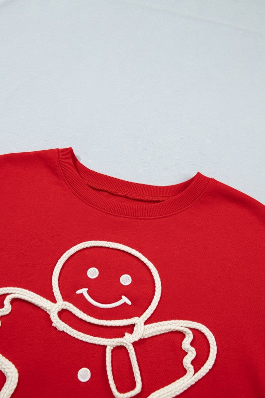 Embroidered gingerbread man sweater
